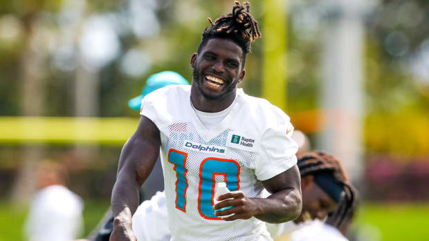 Jun 2, 2022; Miami Gardens, Florida, USA; Miami Dolphins wide receiver Tyreek Hill (10) reacts from the field during minicamp at Baptist Health Training Complex.