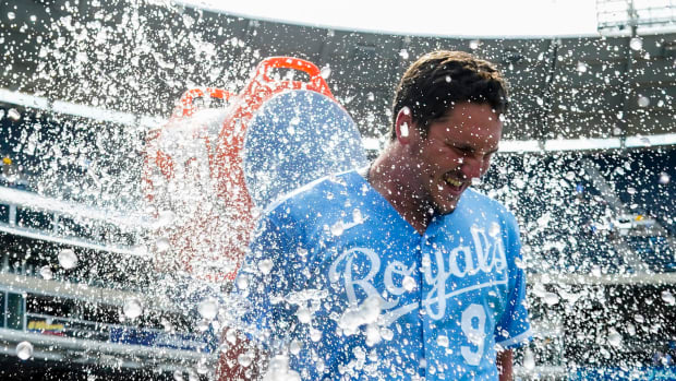 Jul 11, 2022; Kansas City, Missouri, USA; Kansas City Royals first baseman Vinnie Pasquantino (9) is doused with water by shortstop Bobby Witt Jr. (7) after defeating the Detroit Tigers at Kauffman Stadium. Mandatory Credit: Jay Biggerstaff-USA TODAY Sports