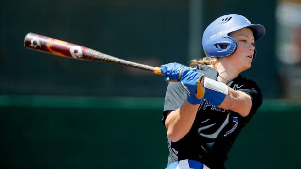 Top MLL draft prospect Jackson Holliday follows through a swing in a high school baseball game.