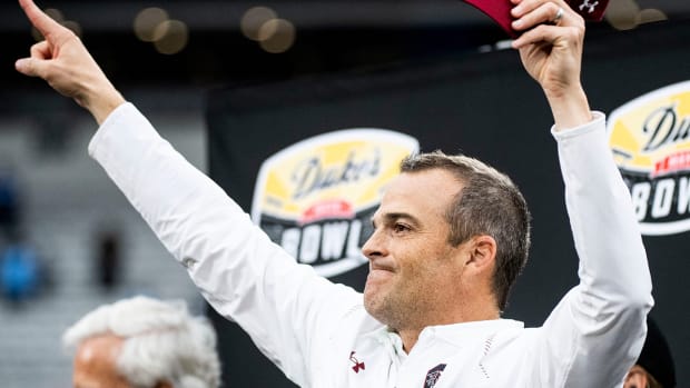 South Carolina coach Shane Beamer celebrates with his team after beating North Carolina in the Duke’s Mayo Bowl.