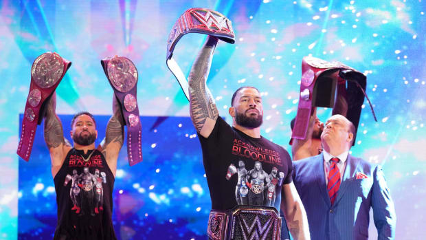 Roman Reigns and the Bloodline pose during WWE RAw