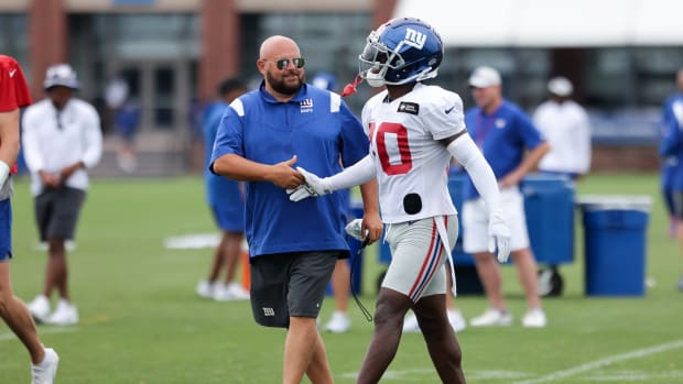 Jul 29, 2022; East Rutherford, NJ, USA; New York Giants head coach Brian Daboll shakes hands with cornerback Darnay Holmes (30) after an interception during training camp at Quest Diagnostics Training Facility.