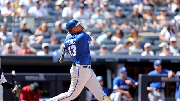 Jul 30, 2022; Bronx, New York, USA; Kansas City Royals catcher Salvador Perez (13) follows through on an RBI sacrifice fly against the New York Yankees during the third inning at Yankee Stadium. Mandatory Credit: Brad Penner-USA TODAY Sports