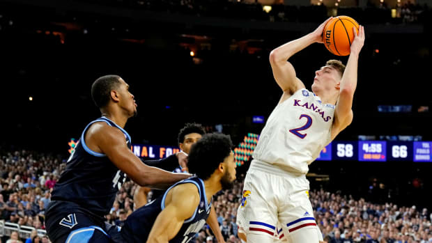 Apr 2, 2022; New Orleans, LA, USA; Kansas Jayhawks guard Christian Braun (2) shoots the ball against Villanova Wildcats guard Caleb Daniels (14) during the second half in the 2022 NCAA men's basketball tournament Final Four semifinals at Caesars Superdome. Mandatory Credit: Robert Deutsch-USA TODAY Sports
