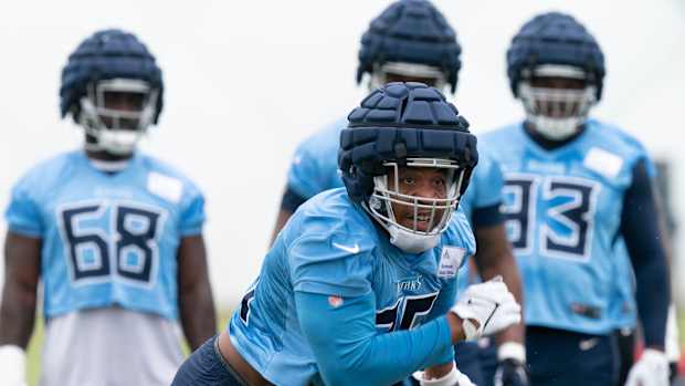 Tennessee Titans defensive lineman DeMarcus Walker (95) runs through pass rush drills during a training camp practice at Saint Thomas Sports Park Thursday, July 28, 2022, in Nashville, Tenn.