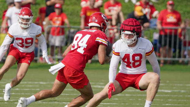 Jul 27, 2022; St. Joseph, MO, USA; Kansas City Chiefs wide receiver Justin Watson (84) runs the ball as linebacker Mike Rose (48) defends during training camp at Missouri Western State University. Mandatory Credit: Denny Medley-USA TODAY Sports