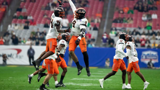 1/1/2022 Glendale, AZ; Notre Dame vs. Oklahoma State in the Fiesta Bowl, Brock Martin (#9) and Kamryn Farrar (#44) celebrate a defensive turnover