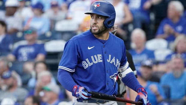 Blue Jays outfielder George Springer looks towards the field after striking out.