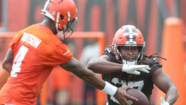 Cleveland Browns quarterback Deshaun Watson hands the ball off to running back Kareem Hunt during OTA practice on Wednesday, May 25, 2022 in Berea.