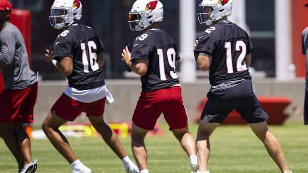 Arizona Cardinals quarterback Colt McCoy (12), Trace McSorley (19) and Jarrett Guarantano (16) during OTA workouts at the teams training facility. Mandatory Credit: Mark J. Rebilas-USA TODAY Sports