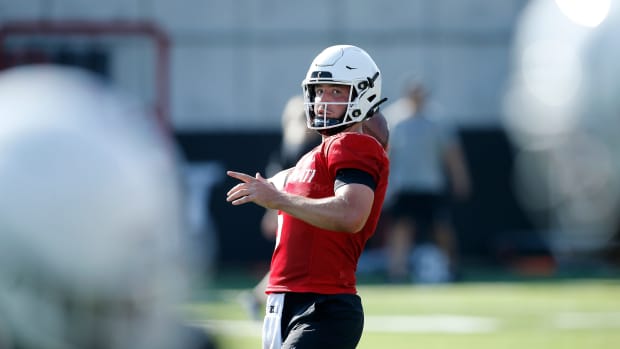 Bearcats quarterback Ben Bryant (6) drops back to throw during the first day of preseason training camp at the University of Cincinnati s Sheakley Athletic Complex in Cincinnati on Wednesday, Aug. 3, 2022. Bearcats Football Camp