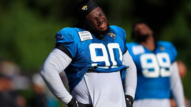 Jaguars defensive tackle Malcom Brown stretches.