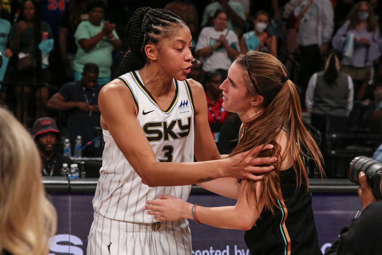 Chicago Sky forward Candace Parker (3) and New York Liberty guard Sabrina Ionescu (20) embrace after game three of the first round at Barclays Center.