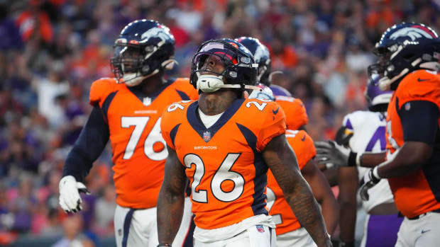 Denver Broncos running back Mike Boone (26) reacts following a turnover in the first quarter against the Minnesota Vikings at Empower Field at Mile High.