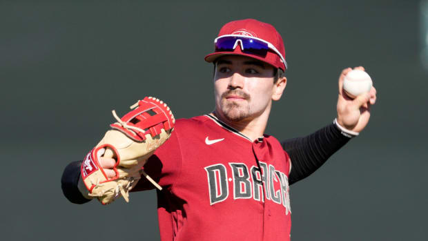Feb 21, 2022; Scottsdale, Ariz., U.S.; Diamondbacks minor league outfielder Corbin Carroll throws during a select training camp for minor-league players not covered by the Players Association at Salt River Fields. MLB continues to be in a lockout after the expiration of the collective bargaining agreement Dec. 2.
