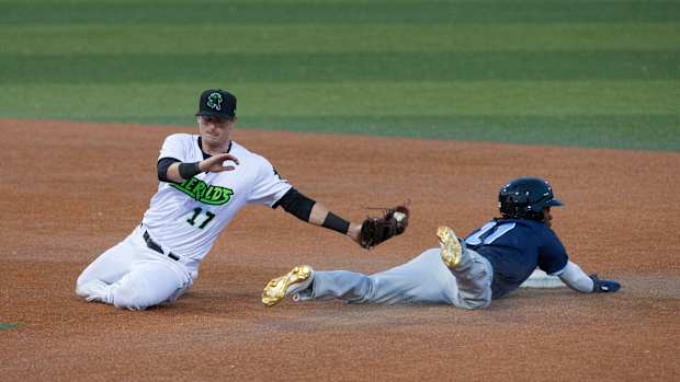 SF Giants prospect Tyler Fitzgerald attempts to tag D.J. Burt. (2021)