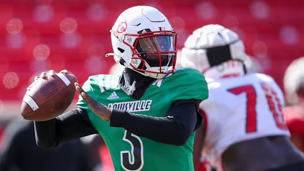 Malik Cunningham throws during practice at Cardinal Stadium on Sunday, April 3, 2021.
