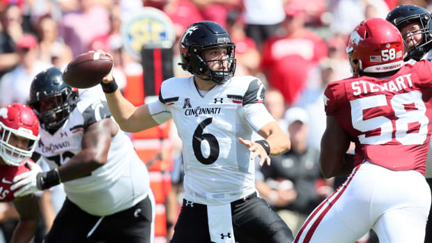 Sep 3, 2022; Fayetteville, Arkansas, USA; Cincinnati Bearcats quarterback Ben Bryant (6) passes in the first quarter against the Arkansas Razorbacks at Donald W. Reynolds Razorback Stadium. Mandatory Credit: Nelson Chenault-USA TODAY Sports