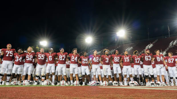 Stanford Cardinal football players gather and sing for fans after defeating the Colgate Raiders at Stanford Stadium. Mandatory Credit: Stan Szeto-USA TODAY Sports