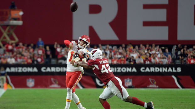 Aug 20, 2021; Glendale, Arizona, USA; Kansas City Chiefs quarterback Patrick Mahomes (15) throws as he is hit by Arizona Cardinals outside linebacker Devon Kennard (42) during the first half at State Farm Stadium. Mandatory Credit: Joe Camporeale-USA TODAY Sports