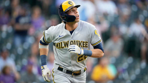 Milwaukee Brewers’ Christian Yelich follows the flight of his solo home run off Colorado Rockies starting pitcher Chad Kuhl in the first inning of a baseball game Tuesday, Sept. 6, 2022, in Denver.