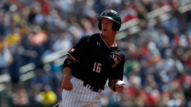 Jun 15, 2019; Omaha, NE, USA; Texas Tech Red Raiders shortstop Josh Jung (16) hens to third base in the sixth inning against the Michigan Wolverines in the 2019 College World Series at TD Ameritrade Park. Mandatory Credit: Bruce Thorson-USA TODAY Sports
