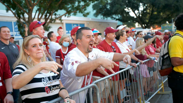 Oklahoma fans gives the Horns Down gesture before the Red River Showdown college football game between the University of Oklahoma Sooners (OU) and the University of Texas (UT) Longhorns at the Cotton Bowl in Dallas, Saturday, Oct. 9, 2021. Ou Vs Texas
