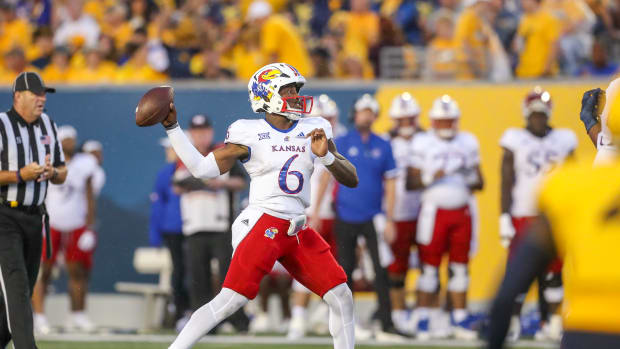 Sep 10, 2022; Morgantown, West Virginia, USA; Kansas Jayhawks quarterback Jalon Daniels (6) passes the ball against the West Virginia Mountaineers during the second quarter at Mountaineer Field at Milan Puskar Stadium. Mandatory Credit: Ben Queen-USA TODAY Sports