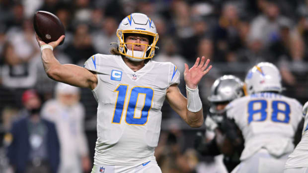 Jan 9, 2022; Paradise, Nevada, USA; Los Angeles Chargers quarterback Justin Herbert (10) throws a pass against the Las Vegas Raiders during the second half at Allegiant Stadium. Mandatory Credit: Orlando Ramirez-USA TODAY Sports