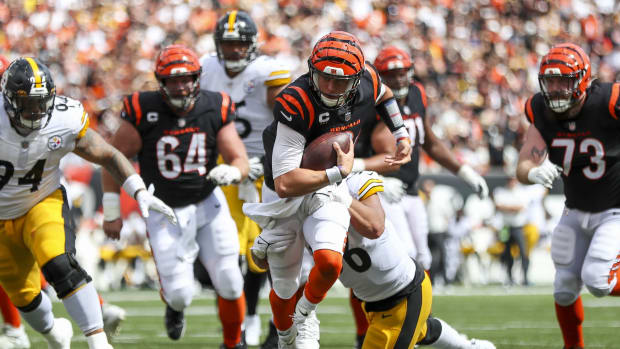Sep 11, 2022; Cincinnati, Ohio, USA; Cincinnati Bengals quarterback Joe Burrow (9) runs with the ball against Pittsburgh Steelers linebacker Alex Highsmith (56) in the second half at Paycor Stadium. Mandatory Credit: Katie Stratman-USA TODAY Sports