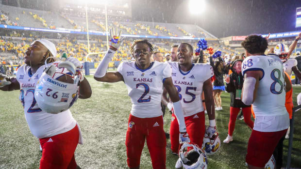 Sep 10, 2022; Morgantown, West Virginia, USA; Kansas Jayhawks cornerback Cobee Bryant (2) celebrates after defeating the West Virginia Mountaineers at Mountaineer Field at Milan Puskar Stadium. Mandatory Credit: Ben Queen-USA TODAY Sports