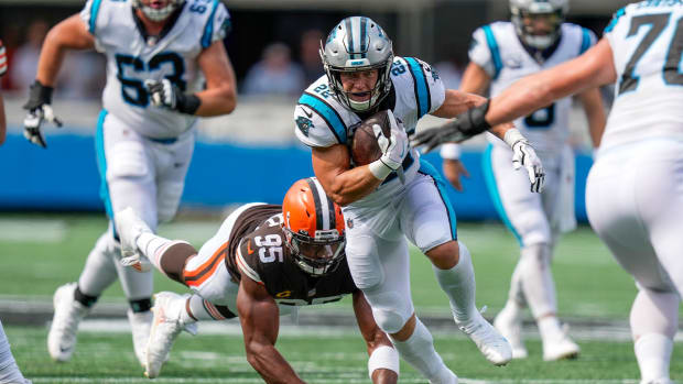 Sep 11, 2022; Charlotte, North Carolina, USA; Cleveland Browns defensive end Myles Garrett (95) dives and misses Carolina Panthers running back Christian McCaffrey (22) during the second half at Bank of America Stadium.