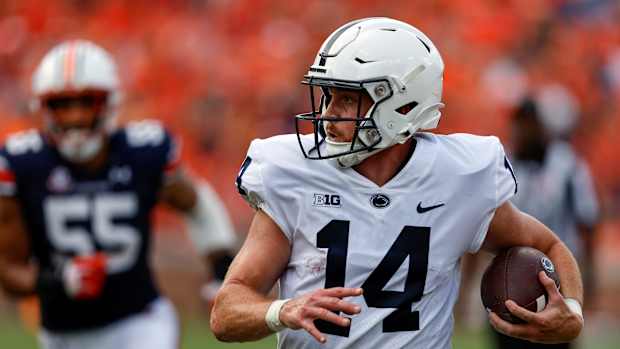 Sean Clifford makes a running play against Auburn.