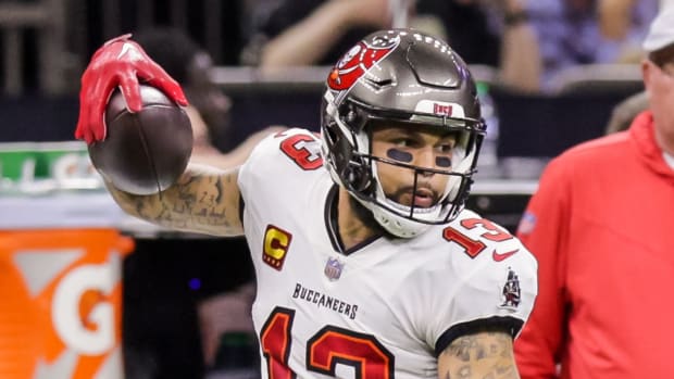 Tampa Bay Buccaneers wide receiver Evans (13) is shoved out of bounds vs. the Saints on Sept. 18, 2022.