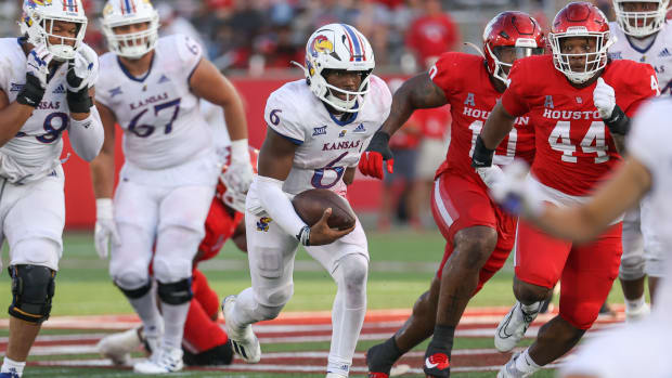 Sep 17, 2022; Houston, Texas, USA; Kansas Jayhawks quarterback Jalon Daniels (6) runs with the ball during the fourth quarter against the Houston Cougars at TDECU Stadium. Mandatory Credit: Troy Taormina-USA TODAY Sports