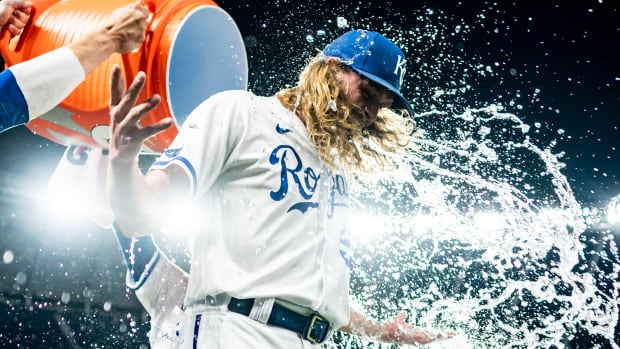 Sep 20, 2022; Kansas City, Missouri, USA; Kansas City Royals relief pitcher Scott Barlow (58) is doused with water after defeating the Minnesota Twins at Kauffman Stadium. Mandatory Credit: Jay Biggerstaff-USA TODAY Sports