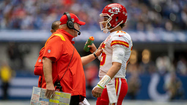 Sep 25, 2022; Indianapolis, Indiana, USA; Kansas City Chiefs head coach Andy Reid (left) talks with quarterback Patrick Mahomes (15) during the second quarter against the Indianapolis Colts at Lucas Oil Stadium. Mandatory Credit: Marc Lebryk-USA TODAY Sports