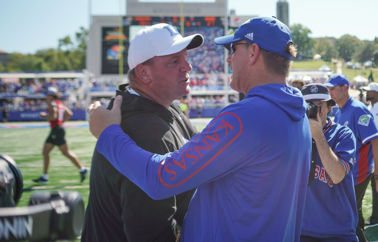 Sep 24, 2022; Lawrence, Kansas, USA; Duke Blue Devils head coach Mike Elko talks with Kansas Jayhawks head coach Lance Leipold on field after the game at David Booth Kansas Memorial Stadium. Mandatory Credit: Denny Medley-USA TODAY Sports
