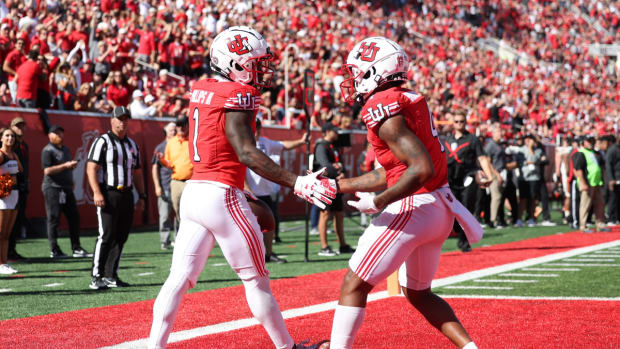 Utah Utes cornerback Clark Phillips III (1) shakes hands with cornerback JaTravis Broughton (4) after making his third interception of the game against the Oregon State Beavers at Rice-Eccles Stadium.