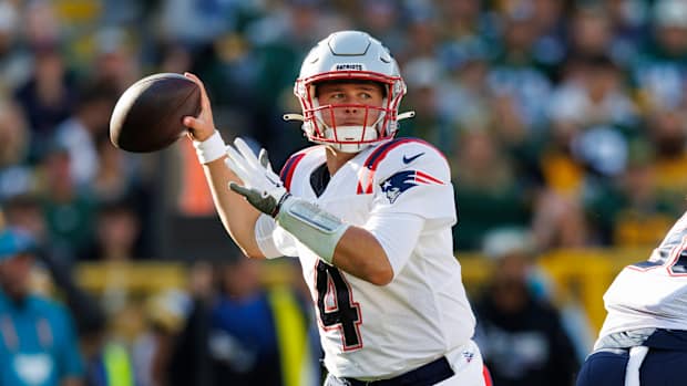 Oct 2, 2022; Green Bay, Wisconsin, USA; New England Patriots quarterback Bailey Zappe (4) throws a pass during the second quarter against the Green Bay Packers at Lambeau Field.