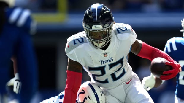 Indianapolis Colts safety Rodney Thomas II (25) works to bring down Tennessee Titans running back Derrick Henry (22) on Sunday, Oct. 2, 2022, during a game against the Tennessee Titans at Lucas Oil Stadium in Indianapolis.