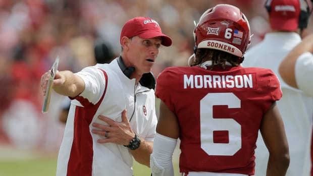 Oklahoma Sooners head coach Brent Venables talks with Oklahoma Sooners defensive back Trey Morrison (6) during the Red River Showdown college football game between the University of Oklahoma (OU) and Texas at the Cotton Bowl in Dallas, Saturday, Oct. 8, 2022. Texas won 49-0. jenni -- cover small