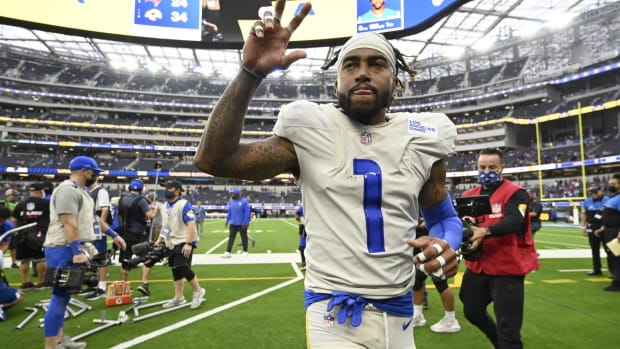Rams wide receiver DeSean Jackson waves to fans while jogging off the field at SoFi Stadium.