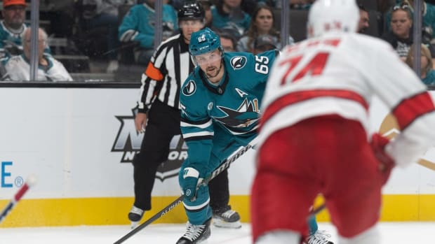 Oct 14, 2022; San Jose, California, USA; San Jose Sharks defenseman Erik Karlsson (65) looks to pass the puck during the second period against the Carolina Hurricanes at SAP Center at San Jose. Mandatory Credit: Stan Szeto-USA TODAY Sports