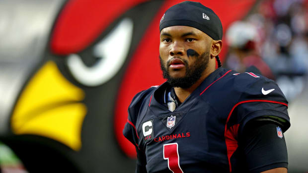 Cardinals quarterback Kyler Murray looks on without a helmet before a game vs. the New Orleans Saints.