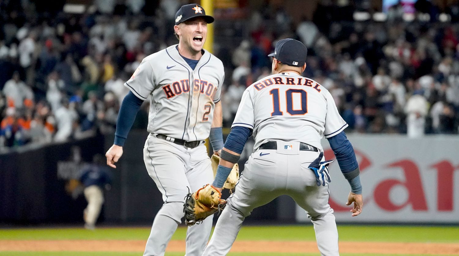Astros third baseman Alex Bregman celebrates with first baseman Yuli Gurriel after beating the Yankees to clinch the AL pennant.