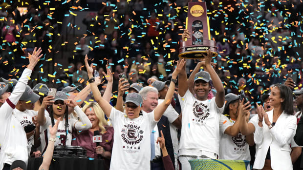 Dawn Staley and Aliyah Boston celebrate South Carolina’s national championship win in 2022.