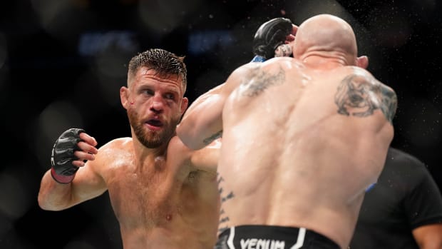 Josh Emmett (blue gloves) fights Calvin Kattar (red gloves) in the featherweight main event fight during UFC Fight Night at Moody Center.