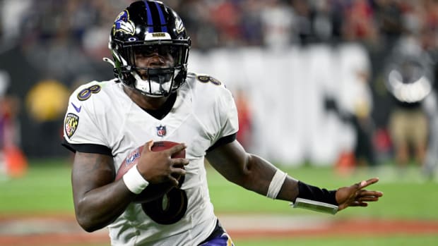 Baltimore Ravens quarterback Lamar Jackson scrambles during the second half of an NFL football game against the Tampa Bay Buccaneers Thursday, Oct. 27, 2022, in Tampa, Fla. (AP Photo/Jason Behnken)