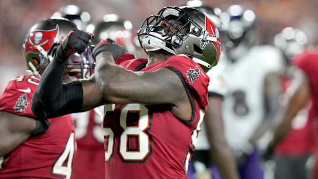 Buccaneers linebacker Shaquil Barrett celebrates after sacking  Ravens quarterback Lamar Jackson.